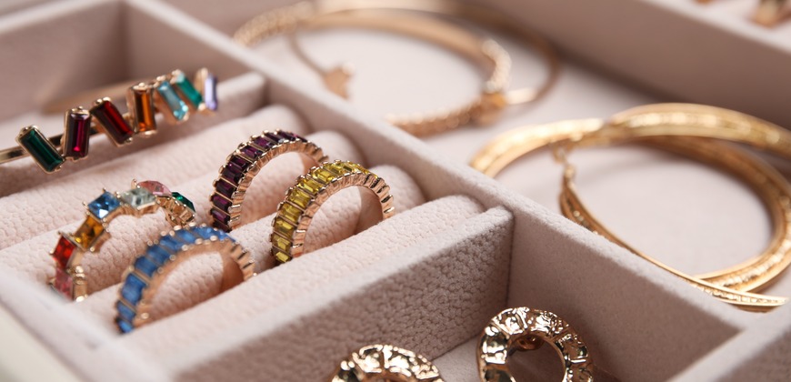Assorted jewelry in a jewelry box tray