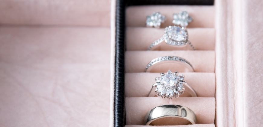 Engagement ring with other rings in a jewelry box