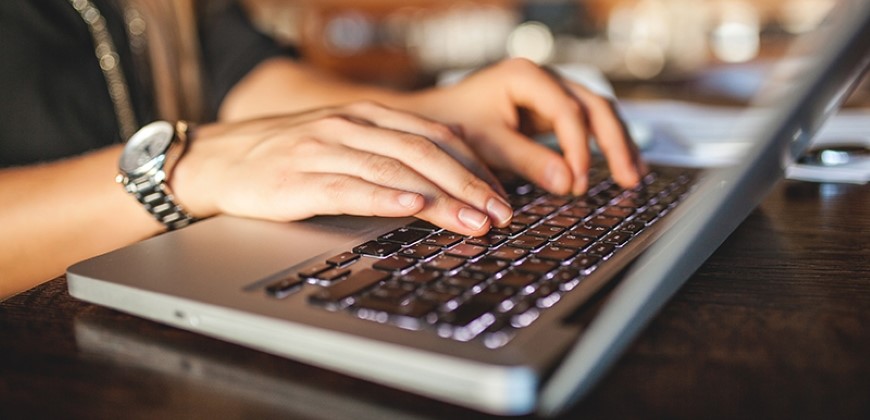 Person typing on a laptop