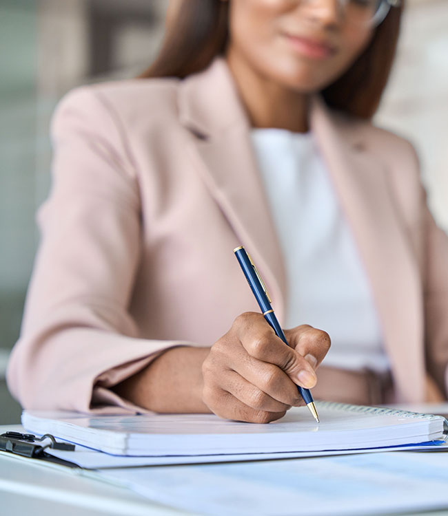 Woman taking notes on notepad