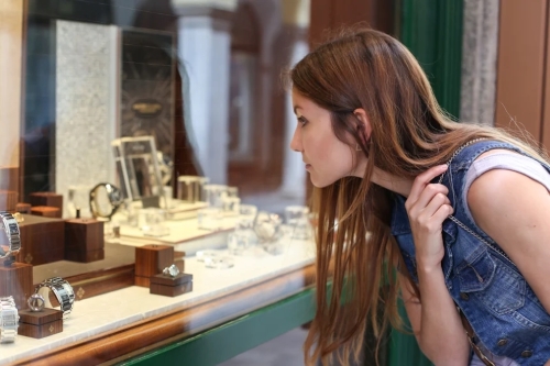 Woman window shopping for jewelry
