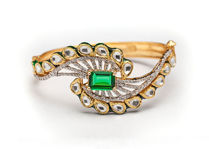 Gold diamond bracelet with stones
