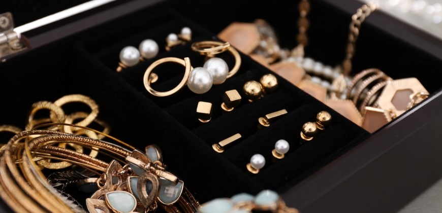 Gold earrings in a jewelry box