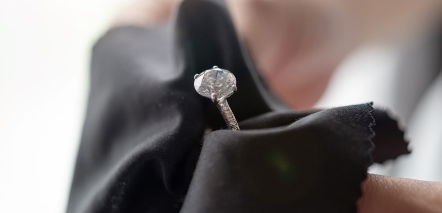Close up of a moissanite ring in a cloth