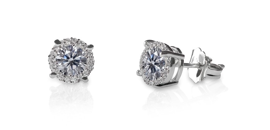 Two diamond studs with earring backs on