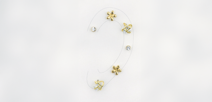 Curated ear design of a drawing of an ear with earrings over the top