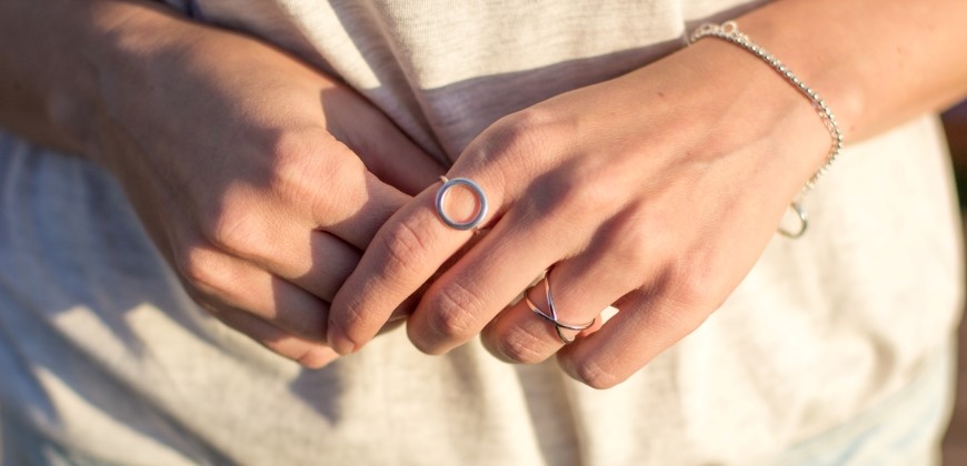Picture of hands with silver rings and bracelets
