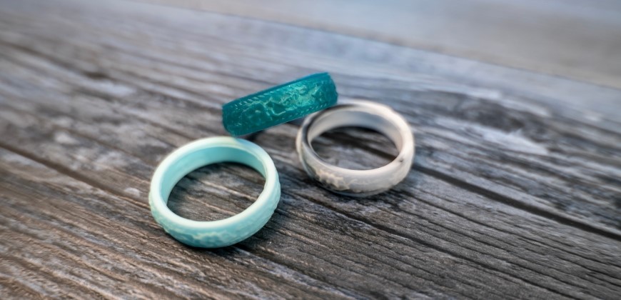 Three silicone rings on a wood background