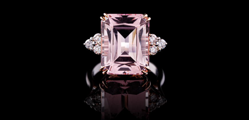 Morganite ring on a reflective black background