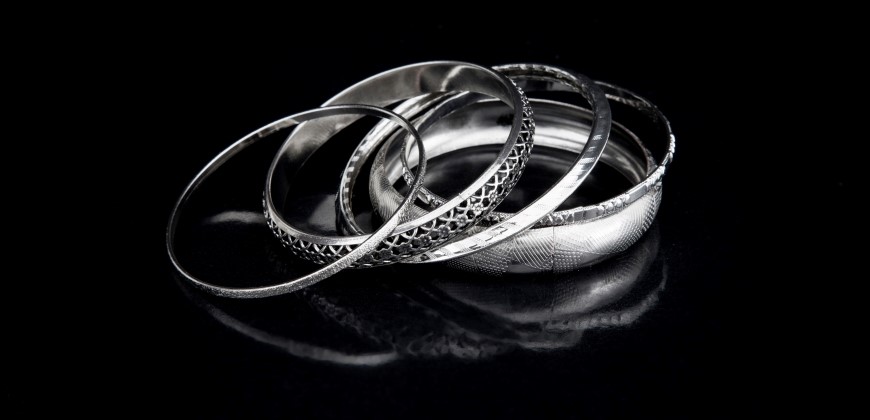 White gold and platinum bracelets next to each other