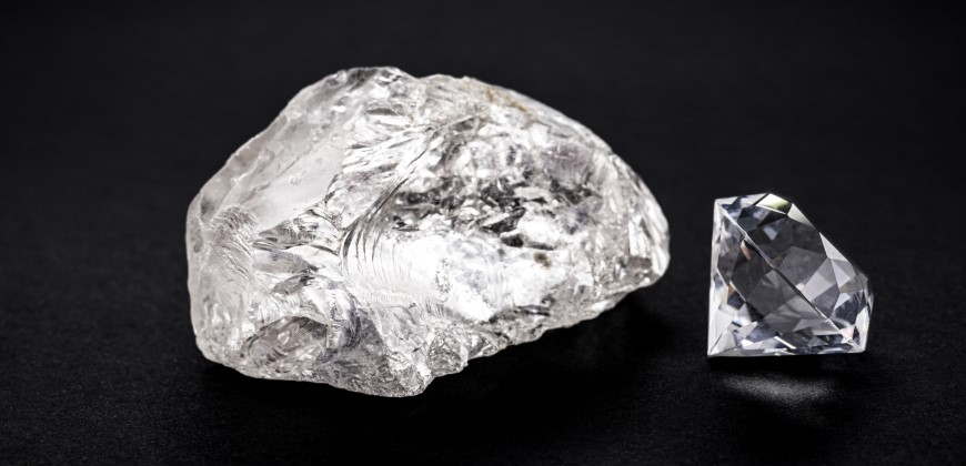Picture of a raw diamond next to a cut diamond