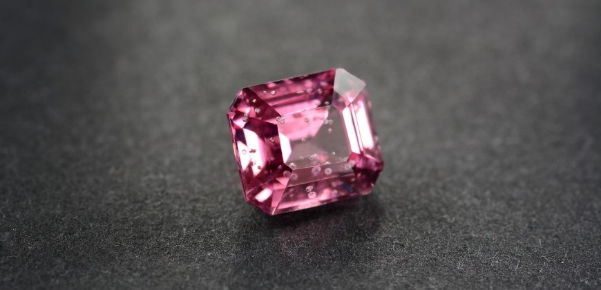 Pink gemstone with air bubble inclusions