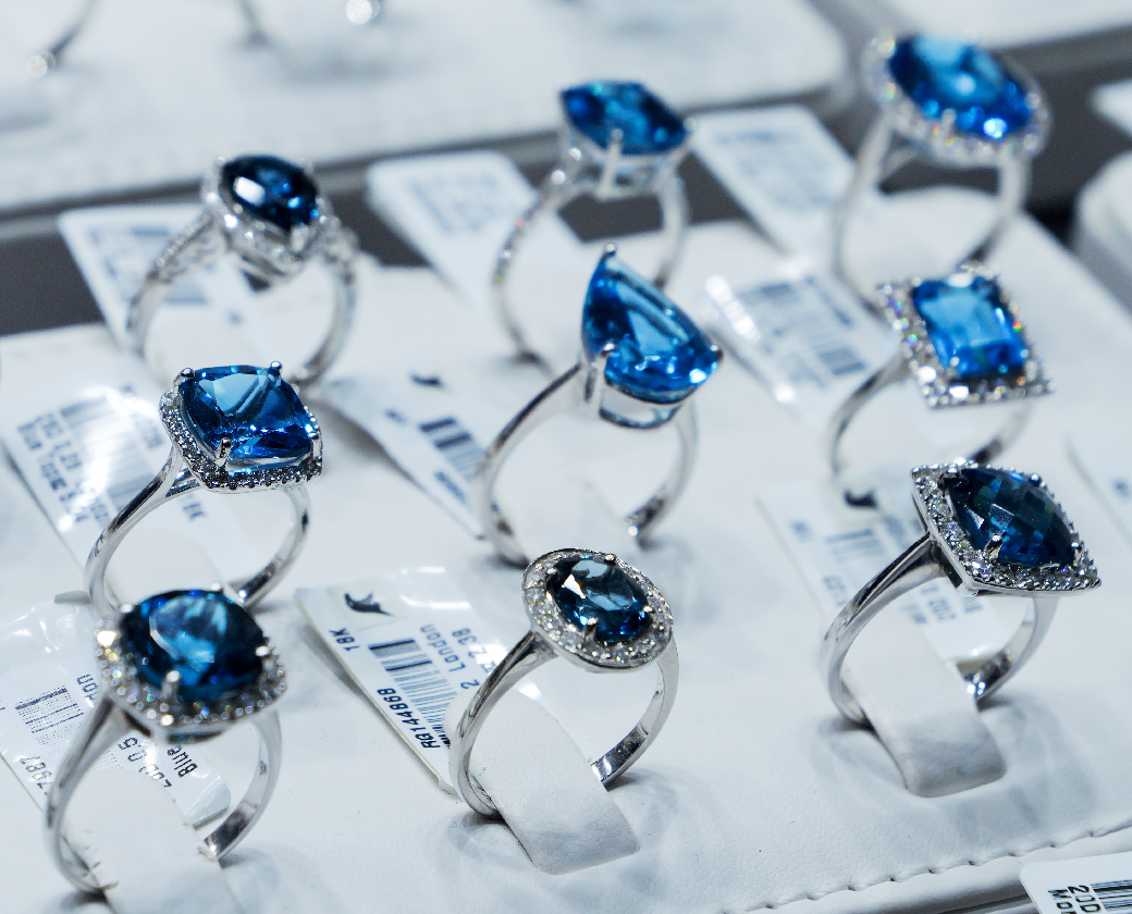 Blue gemstone rings in a case