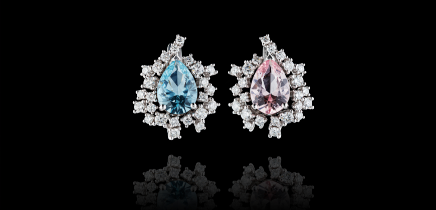 An aquamarine and morganite earring next to each other