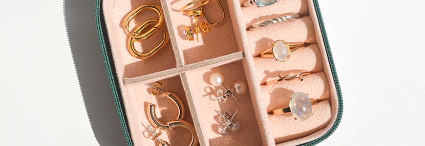 small jewelry case with a variety of rings and earrings