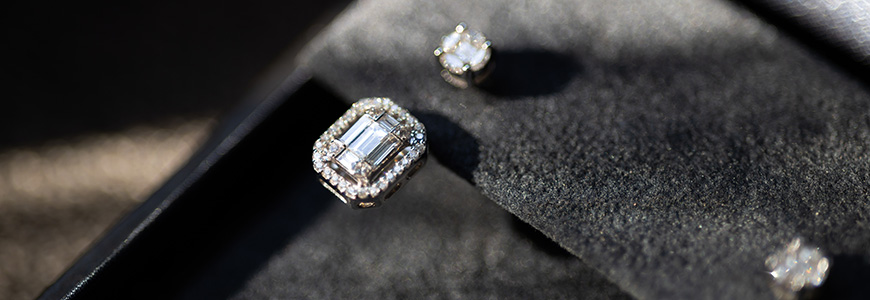 Step cut diamond earring in jewelry cushion