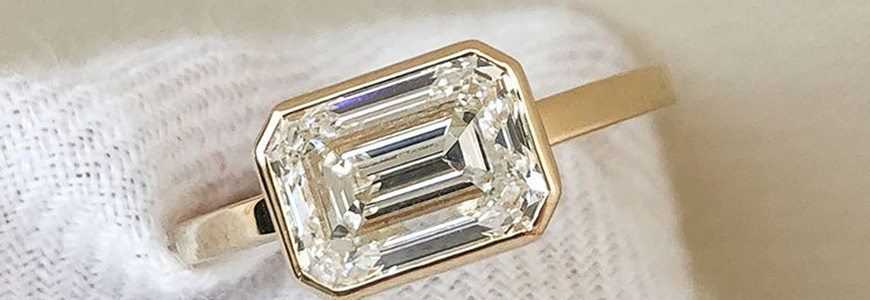 elongated diamond sitting on white wool