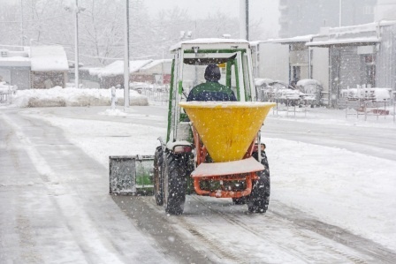 Applying salt to parking lot