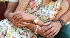 couple holding hands with jewelry