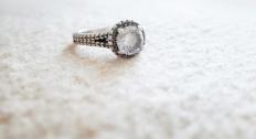 Diamond ring alone on the carpet