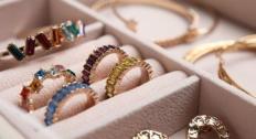Assorted jewelry in a jewelry box tray