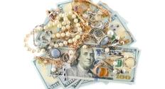 Jewelry on top of $100 bills