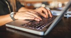 Person typing on a laptop