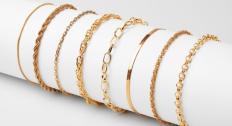 Gold bracelets on a holder