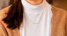 Woman wearing a gold necklace