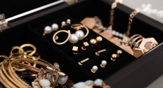Gold earrings in a jewelry box