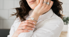 Woman wearing multiple silver rings and a bracelet