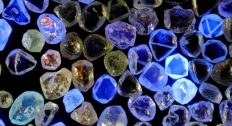 Diamonds on a black background with some glowing