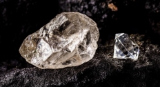 A raw diamond and cut diamond next to each other