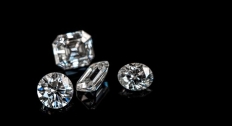 Four different diamonds on a black background