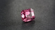 Pink gemstone with air bubble inclusions