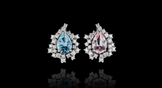 An aquamarine and morganite earring next to each other