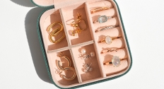 small jewelry case with a variety of rings and earrings 