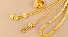 3 gold plated necklaces with varying charms and chains