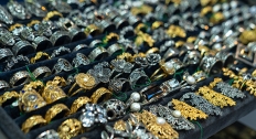 large jewelry display of gold and silver filigree jewelry and rings