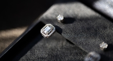 Step cut diamond earring in jewelry cushion
