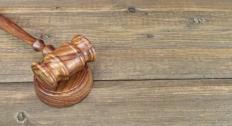 Gavel against woodgrain