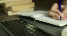 writing in a notebook