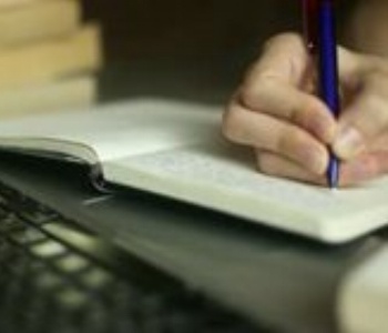writing in a notebook